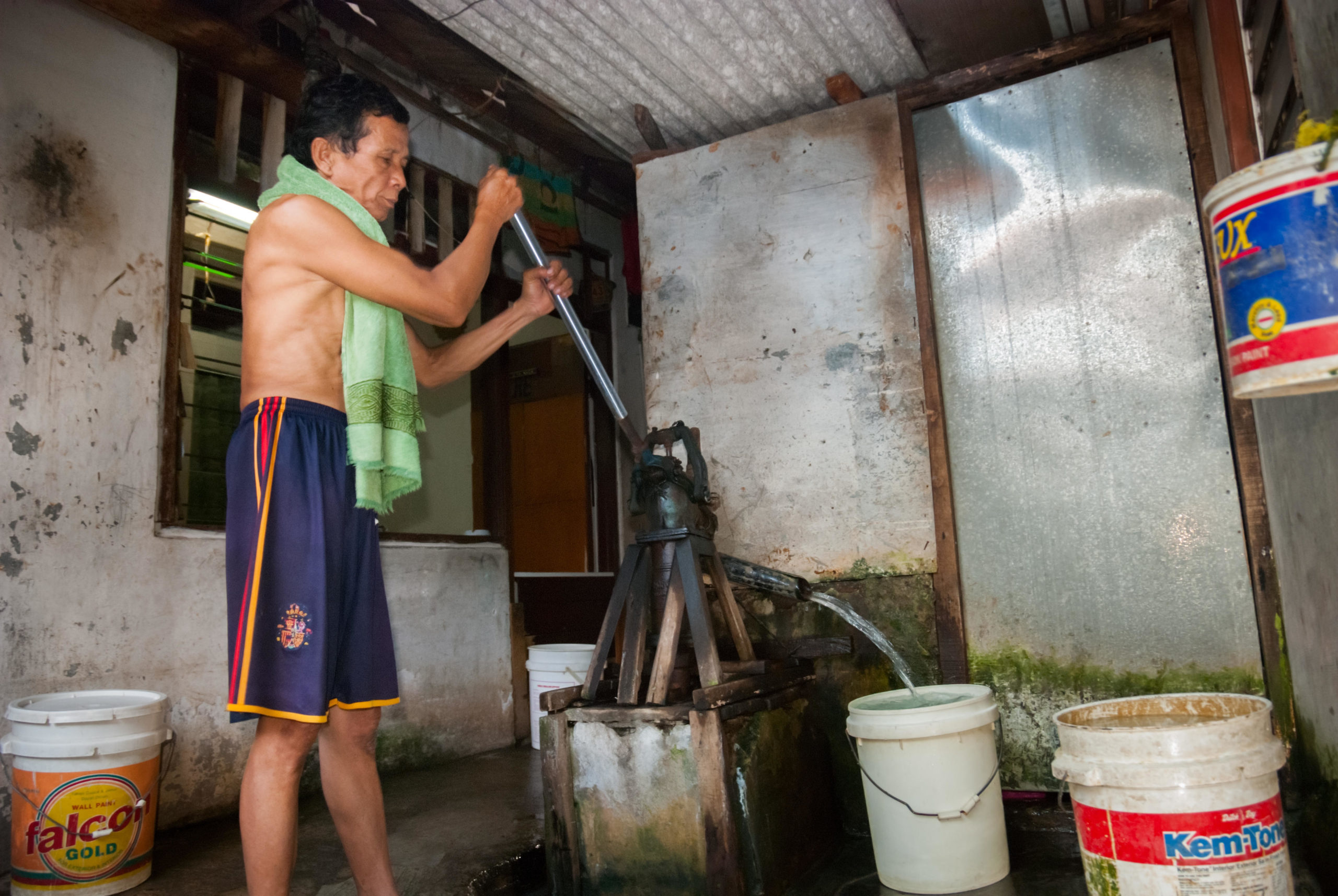 Jakarta resident pumps water