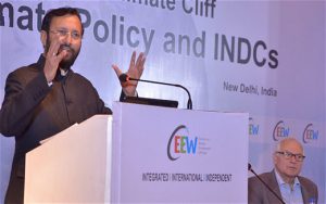 Prakash Javadekar, India’s Minister for Environment, Forests and Climate Change, speaks to a crowd on a podium at a recent New Delhi conference on INDC