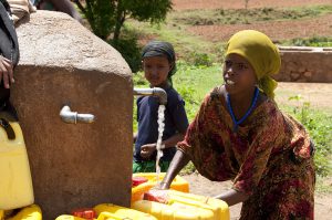 locale girls in Babile, Ethiopia collecting water