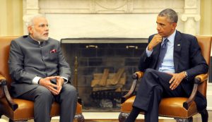 Prime Minister Narendra Modi (left) and US President Barack Obama (right) sit opposite each other.
