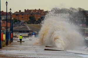 <p>Storm surges are a potent example of how extreme weather can cause major damage to homes and infrastructure (Image by Allan Rabs)</p>