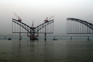 <p>Bridge over the Irrawaddy. Aung San Suu Kyi has created a special commission to evaluate the controversial Myitsone dam (Image by Sean Ryan)</p>
