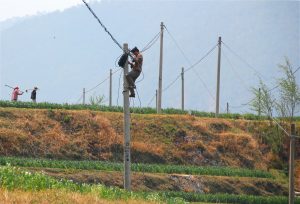<p>Electricity pylons in the Yunnan countryside. China declared full electrification in 2015 after connecting 2.7 million people in remote areas (Image: Morgann)</p>