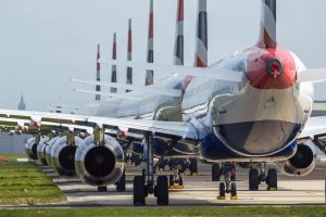 <p>Grounded jets parked at Glasgow Airport. Airlines have reduced flights due to a huge drop in demand caused by the coronavirus pandemic (Image: Alamy)</p>