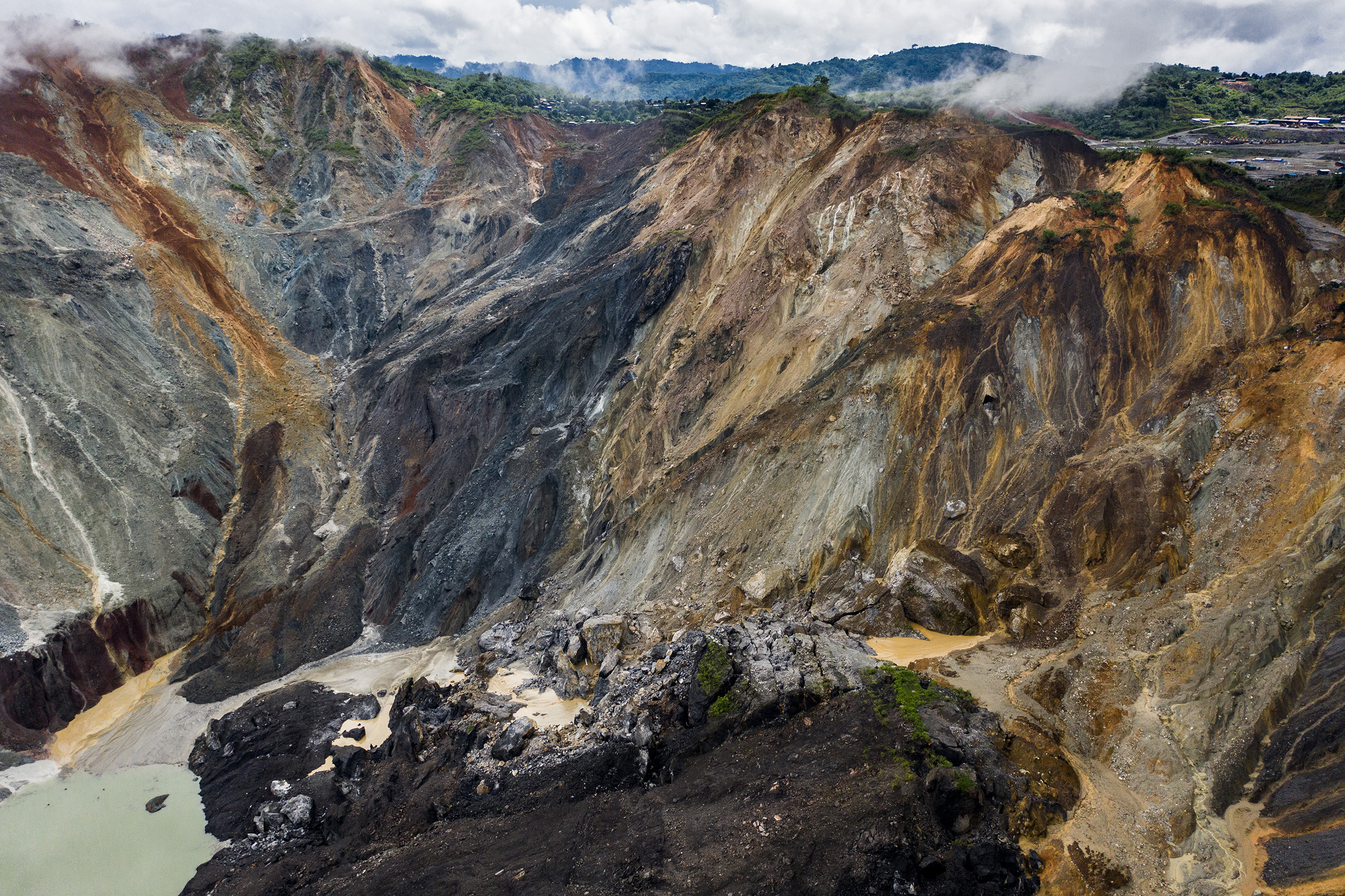 Image 2: Landslides are only too common, especially during the rainy season, when many informal miners switch to working for themselves on the slag heaps (Image © Hkun Lat)