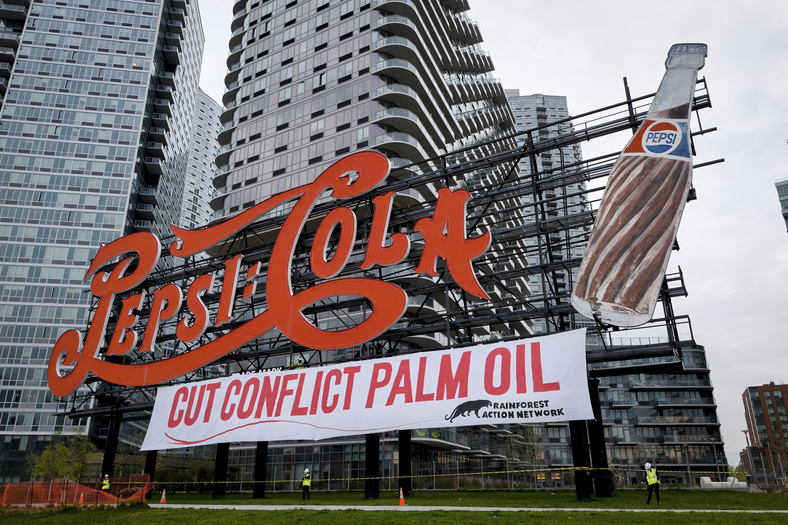 activists with the Rainforest Action Network placed a banner under a famous Pepsi-Cola sign in New York