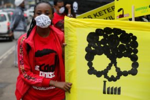 <p>A protestor against what would have been Kenya&#8217;s first coal-fired power plant, in Lamu county (Image: Baz Ratner / Alamy)</p>