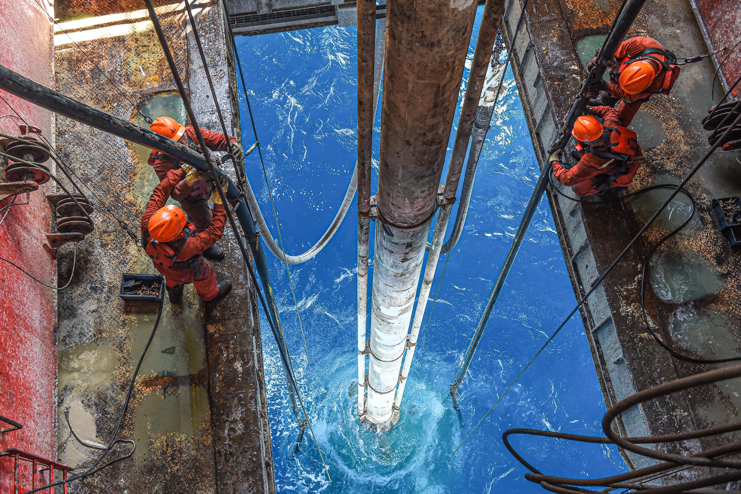 Chinese workers drill for oil in the South China Sea