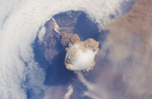 An eruption of the Sarychev volcano on the Kuril islands north of Japan, captured from the International Space Station (Image: <a href="https://www.flickr.com/photos/nasamarshall/26393179990/">NASA</a>, <a href="https://creativecommons.org/licenses/by-nc/2.0/">CC BY NC 2.0</a> )