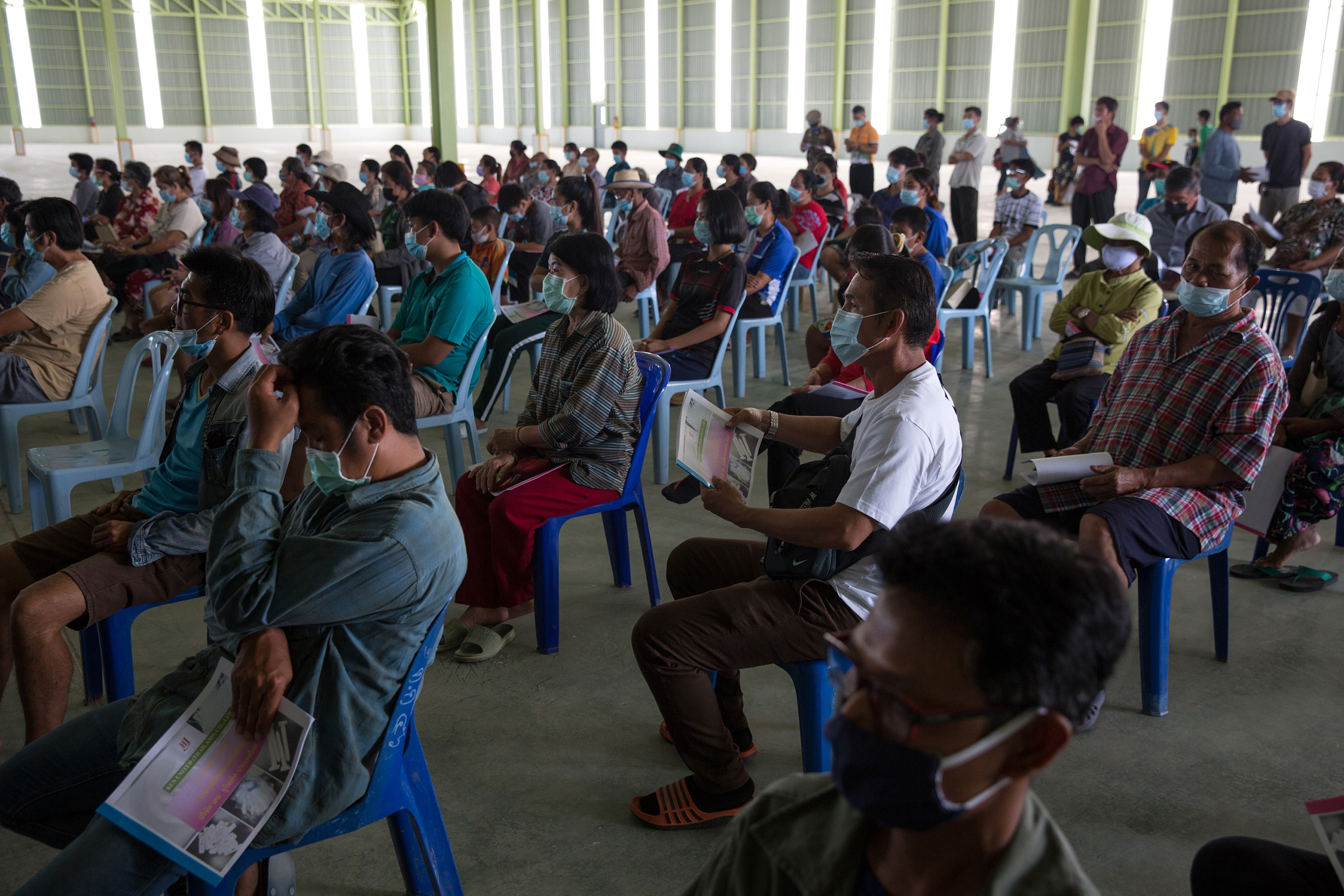 Local villagers from surrounding villages attend a meeting inside the industrial state that plans to become a recycling plant for plastics.