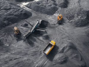 An open-cast coal mine in Russia, July 2020. According to the Global Coal Exit List, 503 of the 1,030 biggest coal companies have plans to develop new assets (Image: Evgenii Parilov / Alamy)