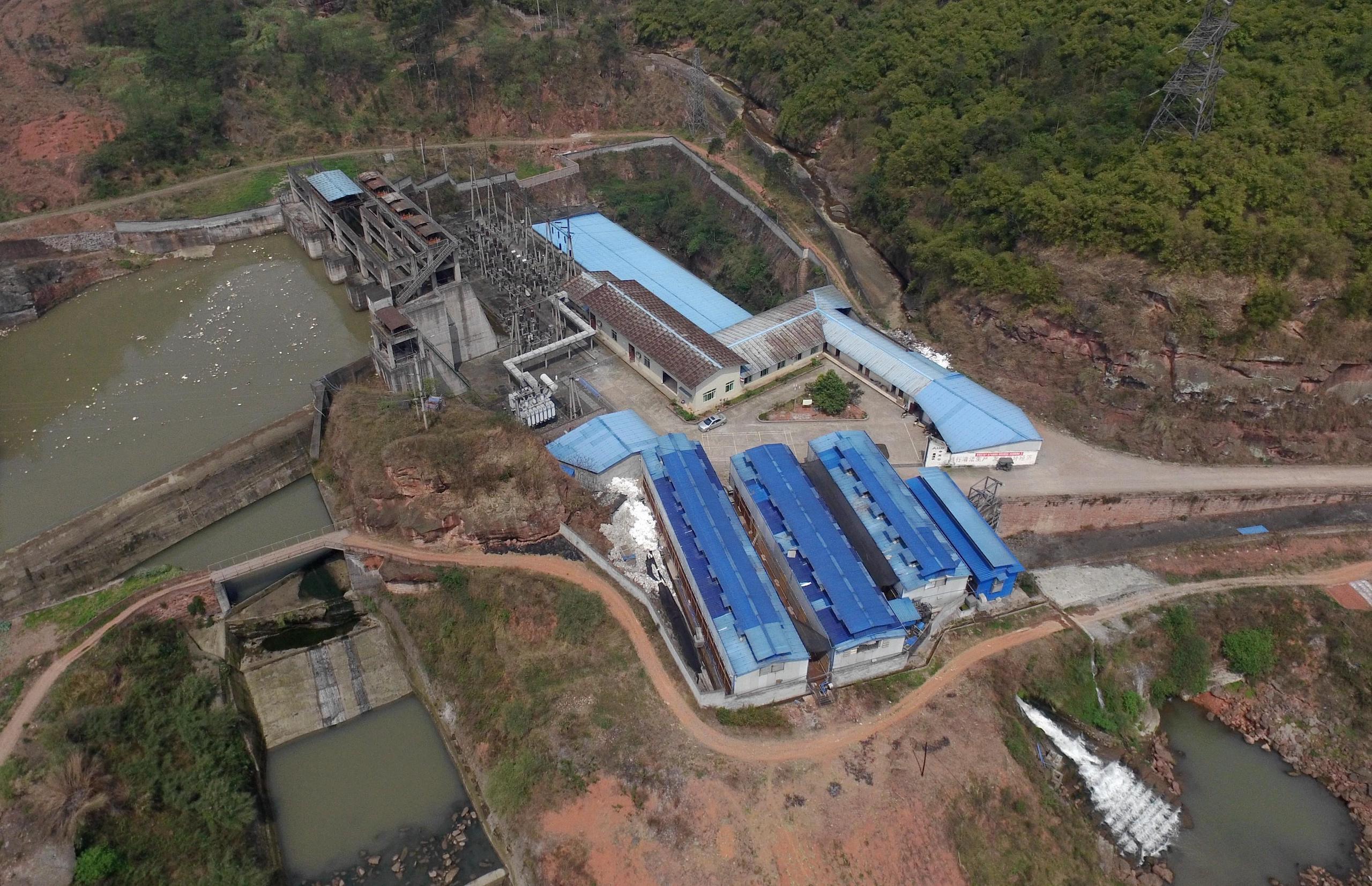 An aerial view of a bitcoin farm next to a hydropower station, southwest China