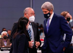 John Kerry speaks to Xie Zhenhua at COP26 climate conference in Glasgow, Scotland