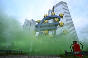 <p>In Frankfurt, Germany, activists protest the inclusion of nuclear energy and natural gas in the EU Taxonomy, which defines the economic activity that qualifies for green funding to help the bloc reach its climate goals (Image: Arne Dedert/Alamy)</p>