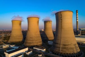 Power station towers with smokey emissions
