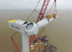 <p>Assembling a wind turbine off the coast of Nantong, Jiangsu province. Several new policy reforms announced in late 2021 are expected to improve the economics of renewable energy in China. (Image: Huang Hai / Alamy)</p>