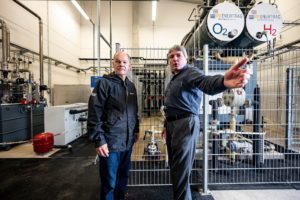 <p>German Chancellor Olaf Scholz (left) visits a hybrid power plant where “green” hydrogen is made using wind power and fed into the gas grid. If Germany is to stop buying gas from Russia in the long term, it will need alternatives. (Image: Fabian Sommer / Alamy)</p>