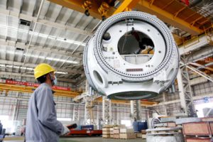 constructing parts for a wind turbine on a factory floor, Jiangsu