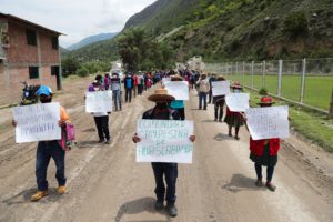 People march with signs reading "No to environmental contamination" and "Farming community of Huascabamba"