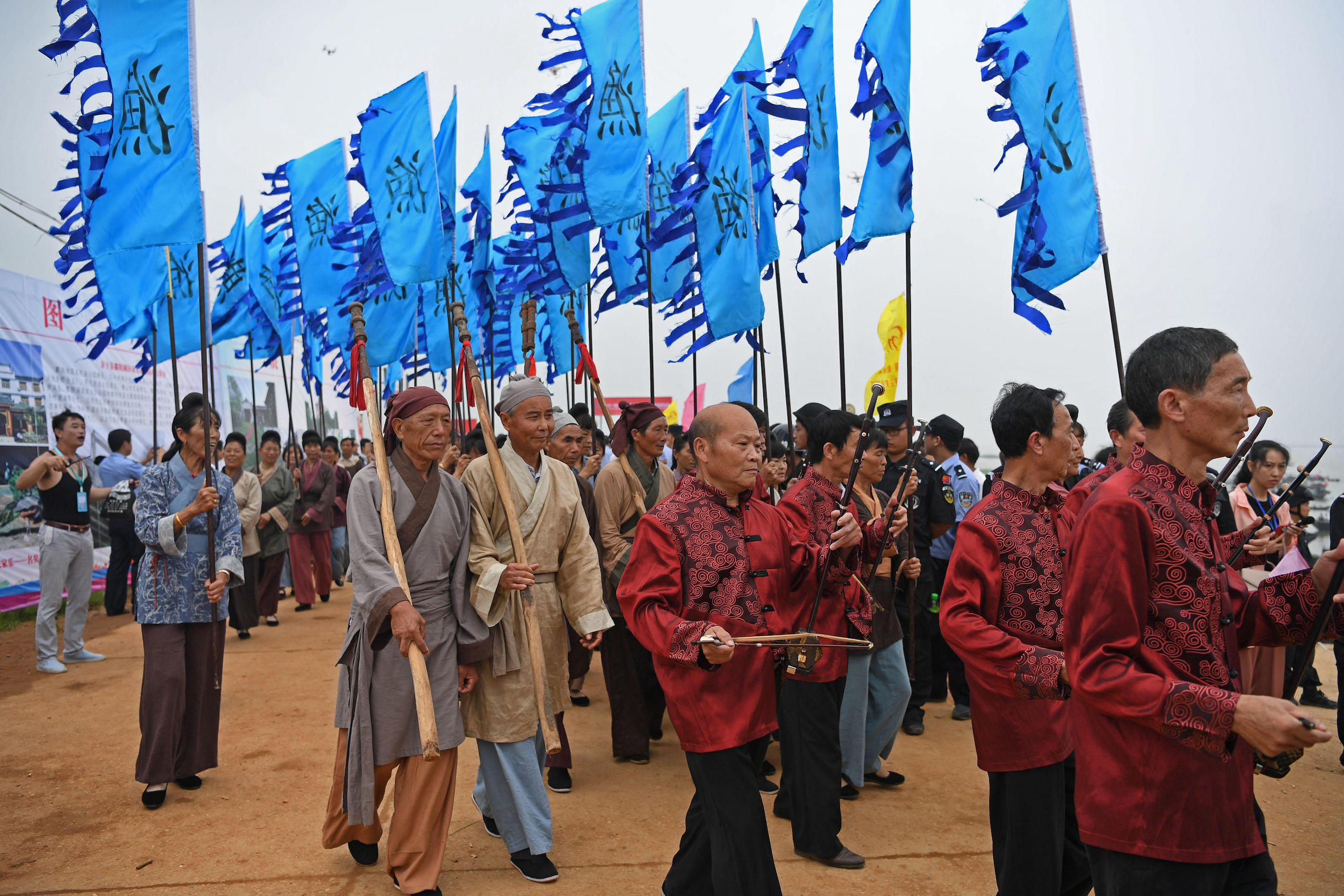 People perform at a celebration of the end of fishing ban in Yugan County, east China's Jiangxi Province