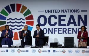people clapping at the end of the 2022 UN ocean conference in Lisbon, Portugal