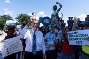 <p>Democratic Senator Ed Markey, a veteran advocate for clean energy and environmental action in the US, takes a selfie with climate activists after the senate passed the Inflation Reduction Act on 7 August (Image: Bill Clark / Alamy)</p>