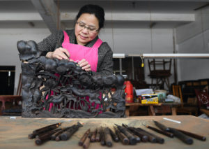 <p>Carving rosewood at a furniture factory in Suzhou, east China (Image: Alamy)</p>