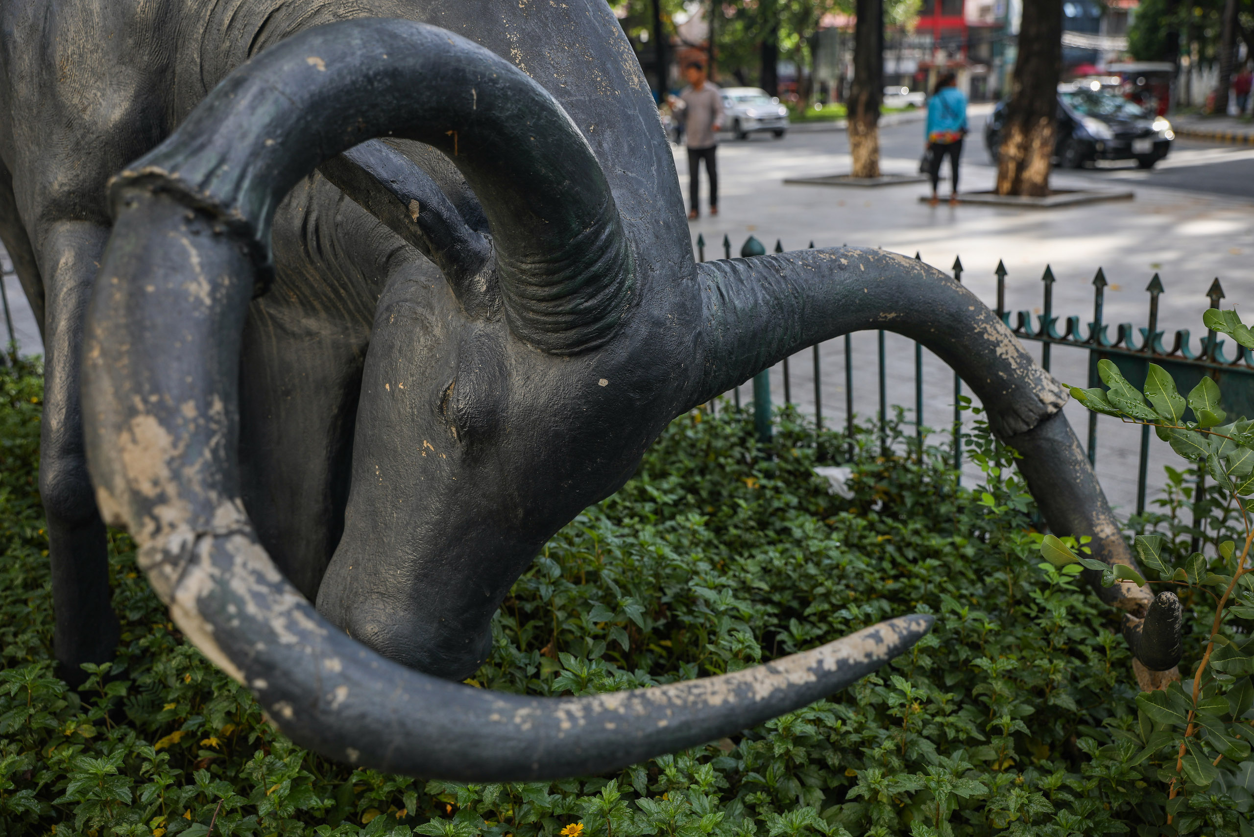 A statue of a kouprey adorns the roundabout of Wat Phnom, a historic pagoda in Cambodia's capital city Phnom Penh