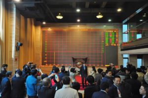 People visit the Shanghai Environment and Energy Exchange(SEEE) where the carbon emission trading program started in 2013