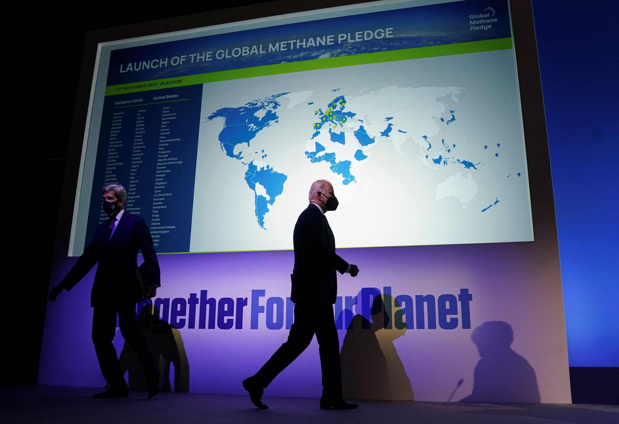 Joe Biden at COP26 under a map of countries signed up to the global methane pledge