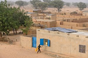 <p>Solar panels on the roof of a home in Niger, West Africa (Image: Joerg Boethling / Alamy)</p>