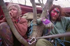 <p>High up a tree in Stanworth Valley woods, northwest England. Exhaustion and trepidation show on the faces of two activists several days into the eviction of their protest site. An extension of the M65 motorway would soon be built. (Image: Adrian Fisk)</p>