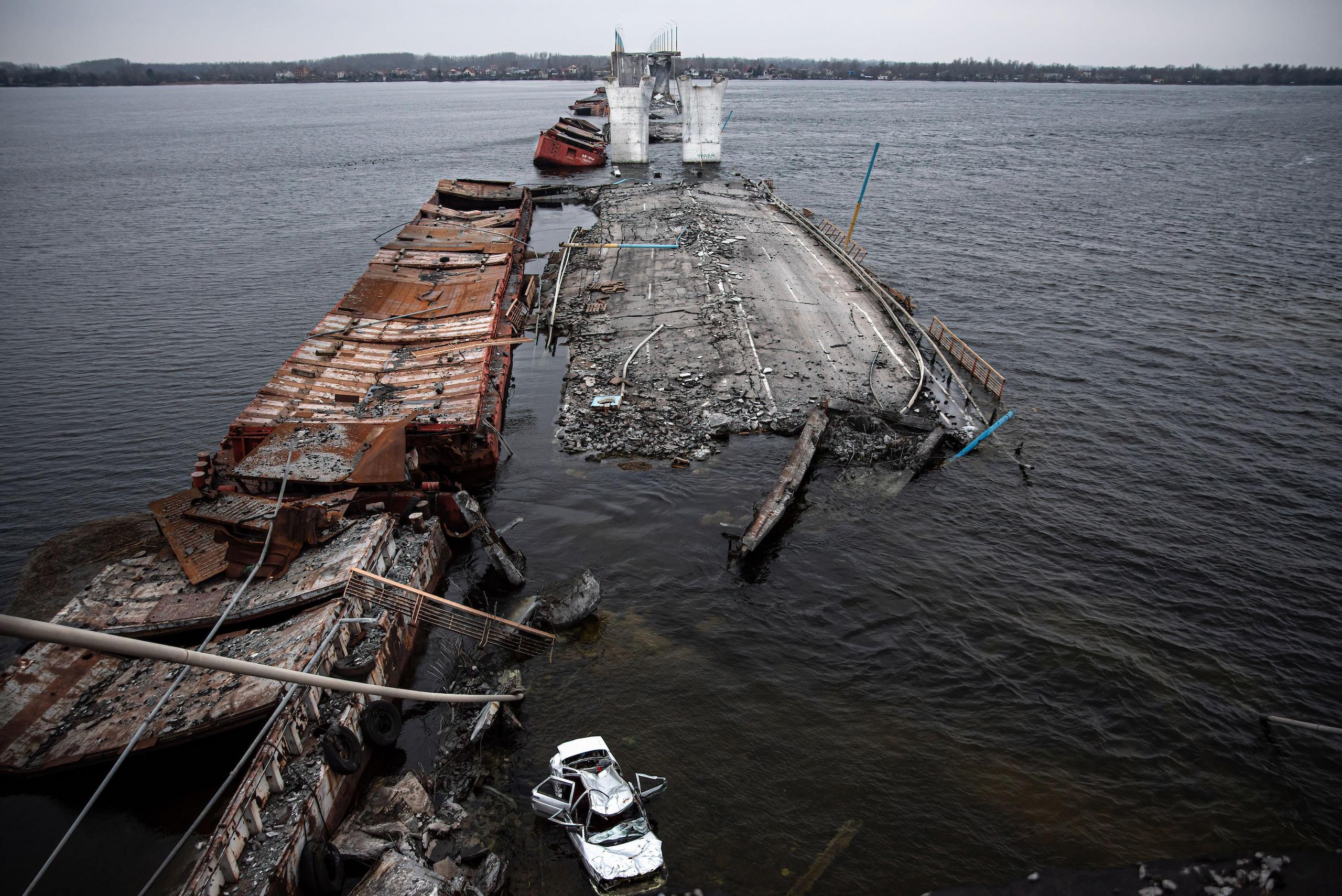 Car seen floating in the Dnieper River after the bridge explosion.