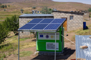 a charging kiosk with a solar panel on top of it